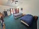 This spacious bedroom has two beds, a sitting area, a ceiling fan and room to roam at 3451 Sagebrush Ave, Pahrump, NV 89048