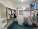 Walk-in closet with ample storage space and convenient built-in shelving and clothes racks at 3451 Sagebrush Ave, Pahrump, NV 89048