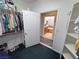 Walk-in closet features shelving, clothes racks, and access to the bathroom at 3451 Sagebrush Ave, Pahrump, NV 89048