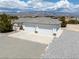 A well-maintained home with a two-car garage and desert landscape and mountain views at 3451 Sagebrush Ave, Pahrump, NV 89048