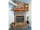 Charming stone fireplace with hearth and mantel adding warmth to the living space at 3451 Sagebrush Ave, Pahrump, NV 89048