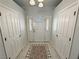 Bright foyer featuring a decorative front door, tiled floors, and closet access at 3451 Sagebrush Ave, Pahrump, NV 89048