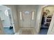 Bright foyer featuring a decorative front door, tiled floors, and closet access at 3451 Sagebrush Ave, Pahrump, NV 89048