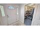 Bright foyer featuring a decorative front door, tiled floors, and closet access at 3451 Sagebrush Ave, Pahrump, NV 89048