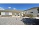 Inviting front entrance with stone accents, covered porch, and desert landscaping at 3451 Sagebrush Ave, Pahrump, NV 89048
