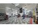 Expansive garage with car lift and tiled floors, great for hobbies at 3451 Sagebrush Ave, Pahrump, NV 89048
