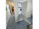 Hallway with view of pull down ironing board and built in storage at 3451 Sagebrush Ave, Pahrump, NV 89048