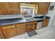 Classic kitchen cabinets with stainless steel appliances and pull-out shelving at 3451 Sagebrush Ave, Pahrump, NV 89048