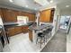 Well-lit kitchen with granite countertops, breakfast bar, and stainless steel appliances at 3451 Sagebrush Ave, Pahrump, NV 89048