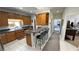 Bright kitchen featuring granite countertops, breakfast bar, and modern stainless steel appliances at 3451 Sagebrush Ave, Pahrump, NV 89048