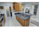Open kitchen layout with granite countertops, a pantry door, and access to living spaces at 3451 Sagebrush Ave, Pahrump, NV 89048