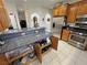 Open kitchen layout with granite countertops, stainless appliances, and seamless access to dining at 3451 Sagebrush Ave, Pahrump, NV 89048
