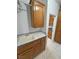 Well-organized laundry area with cabinets and a utility sink at 3451 Sagebrush Ave, Pahrump, NV 89048