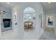 Hallway with arches leads to dining area, showcasing open-concept living and bright interior at 3451 Sagebrush Ave, Pahrump, NV 89048