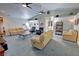 Spacious living room with vaulted ceilings, ceiling fans, and comfortable seating arrangements at 3451 Sagebrush Ave, Pahrump, NV 89048