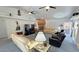 Comfortable living room featuring stone fireplace, vaulted ceilings and open floor plan at 3451 Sagebrush Ave, Pahrump, NV 89048