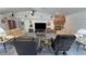 Comfortable living room with fireplace, tv, vaulted ceilings, and comfortable seating at 3451 Sagebrush Ave, Pahrump, NV 89048