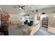 Bright and spacious living room featuring vaulted ceilings and ceiling fans at 3451 Sagebrush Ave, Pahrump, NV 89048
