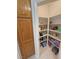 Organized pantry showcases shelving with plenty of food storage, next to cabinet at 3451 Sagebrush Ave, Pahrump, NV 89048