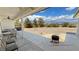 A covered patio featuring a barbecue, a ceiling fan and views of an arid landscape at 3451 Sagebrush Ave, Pahrump, NV 89048