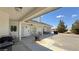 Covered patio with barbecue, ceiling fans, desert landscape views, and furniture at 3451 Sagebrush Ave, Pahrump, NV 89048