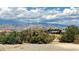Scenic desert landscape showcasing native plants with a backdrop of majestic mountains at 3451 Sagebrush Ave, Pahrump, NV 89048