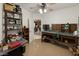 Versatile room with epoxy floor, a crafting table, and shelving for storage at 3451 Sagebrush Ave, Pahrump, NV 89048