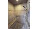Tiled shower with dual shower heads, a bench, and grab bars for accessibility at 3451 Sagebrush Ave, Pahrump, NV 89048