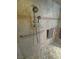 Shower with multiple shower heads, safety bars, and tile surround with decorative border at 3451 Sagebrush Ave, Pahrump, NV 89048