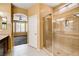 Bathroom with a glass enclosed shower and an entrance to the main bedroom at 3616 Greenbriar Bluff Ave, North Las Vegas, NV 89081