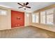 Large bedroom with neutral colors, ceiling fan, and bright windows at 3616 Greenbriar Bluff Ave, North Las Vegas, NV 89081