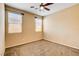 Bedroom with carpet flooring, ceiling fan, and windows providing natural light at 3616 Greenbriar Bluff Ave, North Las Vegas, NV 89081