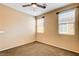 Bedroom featuring neutral walls, carpet, ceiling fan, and windows at 3616 Greenbriar Bluff Ave, North Las Vegas, NV 89081