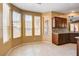 Open dining area with tile floors and multiple windows providing natural light at 3616 Greenbriar Bluff Ave, North Las Vegas, NV 89081