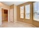 Sunny dining area with tile floors, natural light, and convenient access to a utility room at 3616 Greenbriar Bluff Ave, North Las Vegas, NV 89081