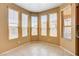 Bright dining area with large windows, tile flooring, and ample sunlight at 3616 Greenbriar Bluff Ave, North Las Vegas, NV 89081