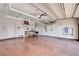 Spacious garage featuring overhead storage racks, a workbench, and ample room for parking and projects at 3616 Greenbriar Bluff Ave, North Las Vegas, NV 89081