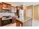 Well-equipped kitchen featuring stainless steel appliances and granite countertops at 3616 Greenbriar Bluff Ave, North Las Vegas, NV 89081