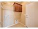 The laundry room offers a storage cabinet and utility connections at 3616 Greenbriar Bluff Ave, North Las Vegas, NV 89081