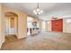 Open floor plan featuring living room, kitchen, and arched doorways at 3616 Greenbriar Bluff Ave, North Las Vegas, NV 89081