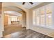 Sitting room with view of living room, shutters, wood floors and ceiling fan at 3616 Greenbriar Bluff Ave, North Las Vegas, NV 89081