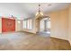 The living room features lots of space, carpet and a large ceiling fan at 3616 Greenbriar Bluff Ave, North Las Vegas, NV 89081
