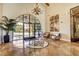 Elegant lobby featuring tile flooring, arched doorway, and stylish decor at 3616 Greenbriar Bluff Ave, North Las Vegas, NV 89081