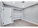Bedroom featuring hardwood floors, light gray walls, a closet, and a white door at 3971 Foxboro Cir, Las Vegas, NV 89121