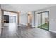 Living space featuring sliding glass doors, wood flooring, and fireplace at 3971 Foxboro Cir, Las Vegas, NV 89121