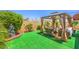 Backyard featuring a gazebo with outdoor seating and manicured landscape at 460 Strawflower Rd, Las Vegas, NV 89107