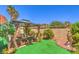 Backyard featuring a gazebo with outdoor seating and manicured landscape at 460 Strawflower Rd, Las Vegas, NV 89107