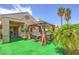 Backyard featuring a gazebo with outdoor seating and manicured landscape at 460 Strawflower Rd, Las Vegas, NV 89107