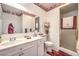 Bathroom featuring a large vanity, shower, and decorative accents at 460 Strawflower Rd, Las Vegas, NV 89107