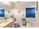 This charming bathroom has a tub and shower combination, and unique design details at 460 Strawflower Rd, Las Vegas, NV 89107